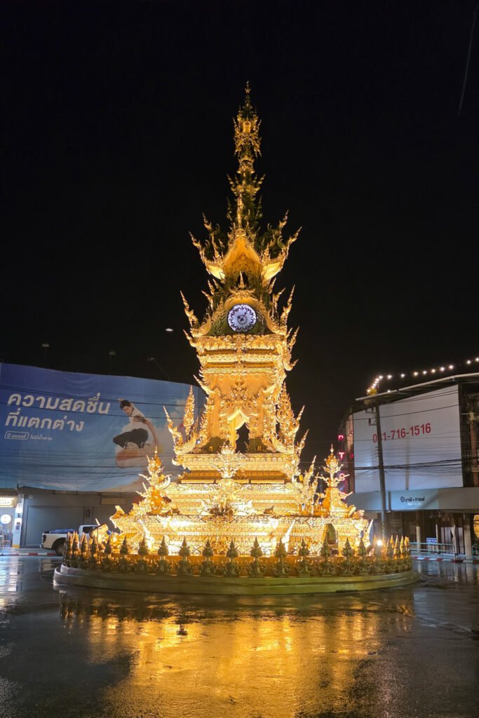 One of the most popular landmarks in Chiang Rai. The Clock Tower, shown in its golden colors on a rainy evening