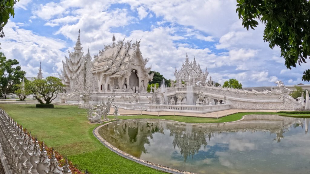 The White Temple in Chiang. A small lake is in the front of the temple.