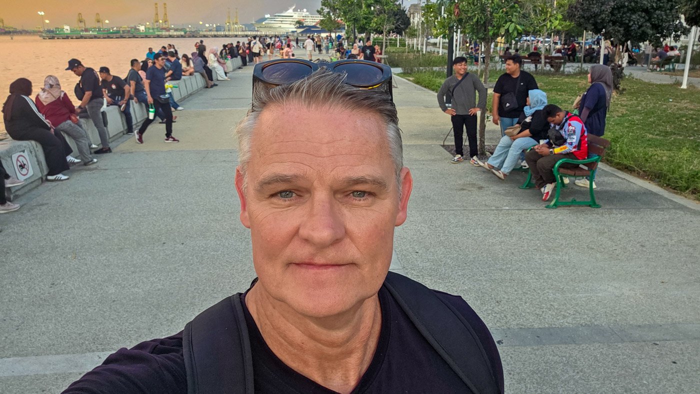 Martin at the waterfront in Penang reflecting on the city