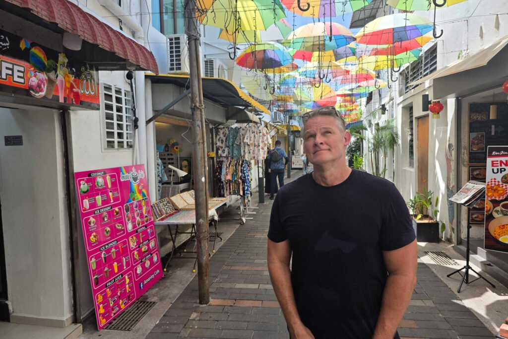 Martin standing on Armenian Street in George Town, Penang looking thoughtfully upward