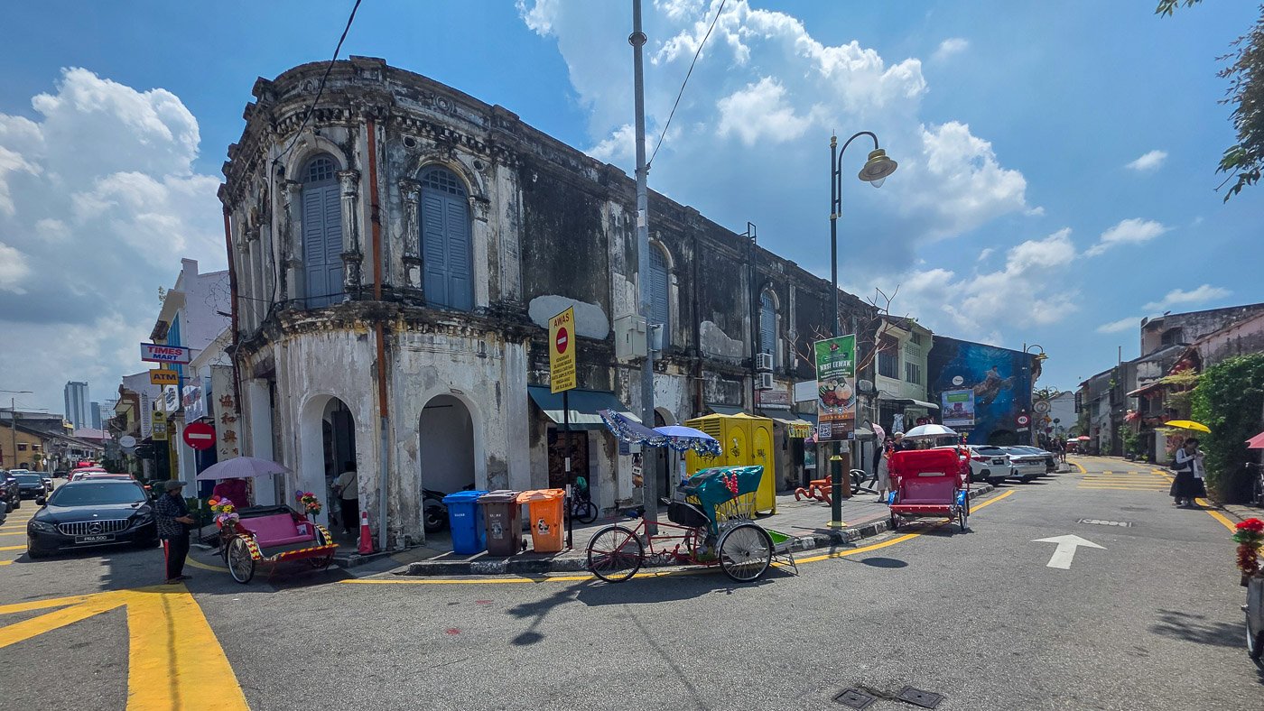 Old corner building near the street art area in George Town, Penang