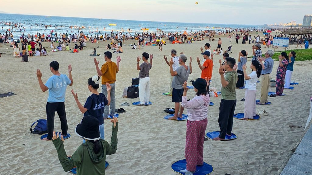 Group exercise session on My Khe Beach in Da Nang, Vietnam