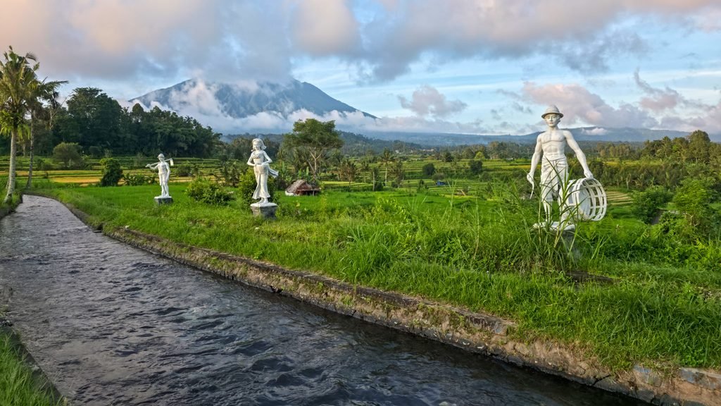 Villagers gathering around irrigation canals in Sidemen, Bali
