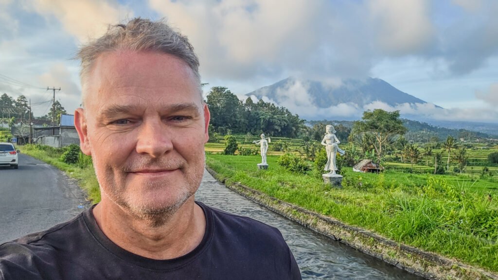 Martin standing beside an irrigation