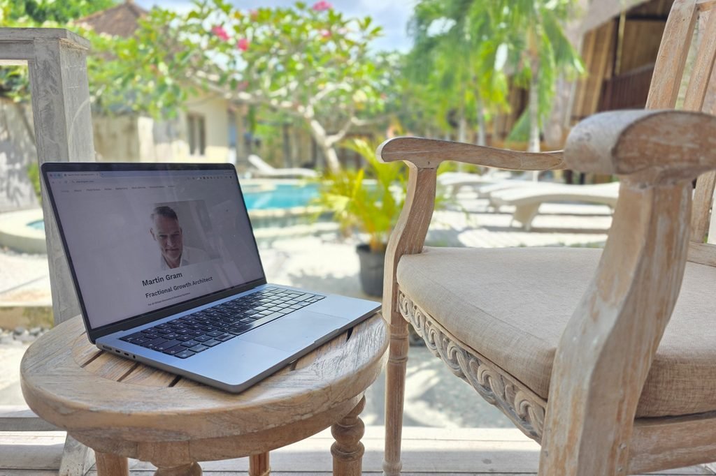 Laptop workspace on a terrace overlooking Nusa Lembongan