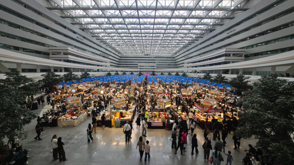 Thai immigration office complex in Bangkok with food stalls and people below